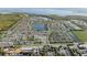 Expansive aerial view of a Primary-planned community featuring lakes, community center, and beautiful landscaping at 7625 Highgrove Ave, Bradenton, FL 34210