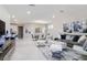 Open-concept living room with contemporary decor, stylish furniture, and bright, airy ambiance at 7625 Highgrove Ave, Bradenton, FL 34210
