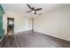 Bright bedroom with sleek floors and access to an ensuite bathroom at 7763 Jenner Ave, New Port Richey, FL 34655