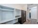 Hallway with shelves and a large, visible safe at 7763 Jenner Ave, New Port Richey, FL 34655