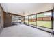 Covered patio featuring a ceiling fan and views of the yard at 7763 Jenner Ave, New Port Richey, FL 34655