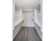 Spacious walk-in closet with organized shelving and ample storage space at 7763 Jenner Ave, New Port Richey, FL 34655
