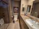 Comfortable bathroom featuring glass door shower, neutral walls, vanity and toilet at 827 Creekside Ln, Palm Harbor, FL 34684
