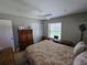 Comfortable bedroom featuring neutral walls, ceiling fan and large closet at 827 Creekside Ln, Palm Harbor, FL 34684