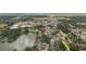 This aerial shot shows the home's close proximity to a tranquil lake and peaceful residential surroundings at 916 Shangri La Dr, Seffner, FL 33584