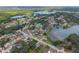 An aerial view of a charming neighborhood with mature trees and picturesque lakes surrounding the homes at 916 Shangri La Dr, Seffner, FL 33584