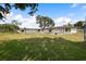 A large backyard features mature trees and a peaceful outdoor space at 916 Shangri La Dr, Seffner, FL 33584