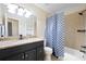 Bathroom featuring a tub and shower combo with modern tiling and plenty of vanity storage space at 916 Shangri La Dr, Seffner, FL 33584