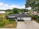 Charming single-story home boasting an attached garage, well-kept landscaping, and close proximity to local lake at 916 Shangri La Dr, Seffner, FL 33584