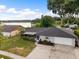 Attractive single-story home boasting a well-maintained lawn and an attached garage, plus screened in patio at 916 Shangri La Dr, Seffner, FL 33584