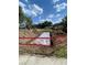 Construction pit in the front yard marked off with danger tape, a new septic system being installed at 916 Shangri La Dr, Seffner, FL 33584