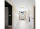 Bright hallway with multiple entry points and neutral paint, waiting for your personal touch at 916 Shangri La Dr, Seffner, FL 33584