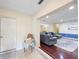 Inviting home entryway flows into a living area with a comfortable gray couch and stylish blue rug at 916 Shangri La Dr, Seffner, FL 33584