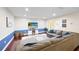 Comfortable living room with a large sectional sofa, stylish rug, and a mounted television at 916 Shangri La Dr, Seffner, FL 33584