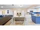 Open-concept living space with a dining table and a kitchen with stainless steel appliances and granite countertops at 916 Shangri La Dr, Seffner, FL 33584