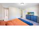 Warm and inviting bedroom features a large bed, neutral walls, and easy access to the bathroom at 916 Shangri La Dr, Seffner, FL 33584