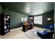 Office offers dark green walls, built in shelves and dark wood desk, perfect for a productive day at 916 Shangri La Dr, Seffner, FL 33584