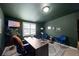 Office offers dark green walls and dark wood desk, perfect for a productive day at 916 Shangri La Dr, Seffner, FL 33584