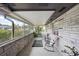 Relaxing screened-in porch with rocking chairs and tile flooring, perfect for enjoying the outdoors at 916 Shangri La Dr, Seffner, FL 33584