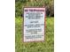 Sign outlining lake access rules for Shangri La residents, including hours and watercraft restrictions at 916 Shangri La Dr, Seffner, FL 33584