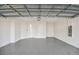 Spacious two-car garage with an epoxy floor and ample room for vehicles and storage at 9474 Shorebird Ct, Parrish, FL 34219