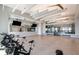 Community gym with stationary bikes, mirrors, and ceiling fans for a comfortable workout environment at 9474 Shorebird Ct, Parrish, FL 34219