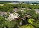 Beautiful aerial view of community featuring a lovely pond, fountain, and lush greenery at 10203 Courtney Palms Blvd # 301, Tampa, FL 33619