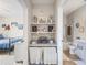 Well-organized bathroom with built-in shelves and adjacent bedroom in this inviting home at 10203 Courtney Palms Blvd # 301, Tampa, FL 33619