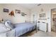Well-lit bedroom featuring unique decor and ample space at 10203 Courtney Palms Blvd # 301, Tampa, FL 33619