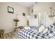 Spacious bedroom featuring clean design, light floors, and bathroom access at 10203 Courtney Palms Blvd # 301, Tampa, FL 33619