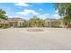 Grand entrance to a community with a fountain and circular brick driveway at 10203 Courtney Palms Blvd # 301, Tampa, FL 33619