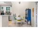 Bright dining area features a playful table set and a view of the modern kitchen at 10203 Courtney Palms Blvd # 301, Tampa, FL 33619