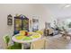 Bright dining area and living room featuring natural light and modern décor at 10203 Courtney Palms Blvd # 301, Tampa, FL 33619
