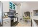 Well-equipped kitchen with stainless steel appliances and adjacent dining area at 10203 Courtney Palms Blvd # 301, Tampa, FL 33619