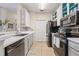 Modern kitchen featuring stainless steel appliances, stylish countertops and tiled backsplash at 10203 Courtney Palms Blvd # 301, Tampa, FL 33619