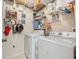 Organized laundry room with shelves and storage for supplies at 10203 Courtney Palms Blvd # 301, Tampa, FL 33619