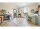 Bright living room featuring a large window, stylish furniture, and elegant decor at 10203 Courtney Palms Blvd # 301, Tampa, FL 33619