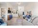 Cozy living room with hardwood floors, ceiling fan, and lots of natural light at 10203 Courtney Palms Blvd # 301, Tampa, FL 33619