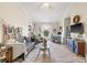 Bright living room featuring hardwood floors and a ceiling fan at 10203 Courtney Palms Blvd # 301, Tampa, FL 33619