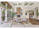 Inviting lounge area with stone fireplace, coffered ceilings, and comfortable seating, perfect for relaxation at 10203 Courtney Palms Blvd # 301, Tampa, FL 33619