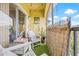 Relaxing patio features artificial grass, string lights, and wicker fence for privacy at 10203 Courtney Palms Blvd # 301, Tampa, FL 33619