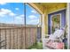 Charming patio features artificial grass, string lights, and wicker fence for privacy at 10203 Courtney Palms Blvd # 301, Tampa, FL 33619