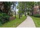 Picturesque walkway leading through lush greenery to a well-maintained apartment complex at 10203 Courtney Palms Blvd # 301, Tampa, FL 33619