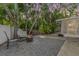 Inviting backyard patio with seating, fire pit, and well-maintained landscaping, perfect for outdoor relaxation at 1041 Forest Grove Blvd, Palm Harbor, FL 34683