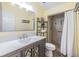 Bathroom featuring a vanity with a marble countertop and a tiled shower at 1041 Forest Grove Blvd, Palm Harbor, FL 34683