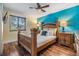 Bedroom featuring natural lighting and a decorative headboard at 1041 Forest Grove Blvd, Palm Harbor, FL 34683