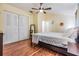 Bedroom featuring hardwood floors, closet, and a vaulted ceiling at 1041 Forest Grove Blvd, Palm Harbor, FL 34683