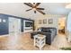 Cozy living room features an accent wall, tile flooring, and comfortable seating area at 1041 Forest Grove Blvd, Palm Harbor, FL 34683