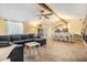 Open concept living area with exposed beam, dining area, and comfortable seating at 1041 Forest Grove Blvd, Palm Harbor, FL 34683