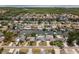Neighborhood aerial view of waterfront community, homes, and docks on a sunny day at 10710 Donbrese Ave, Tampa, FL 33615
